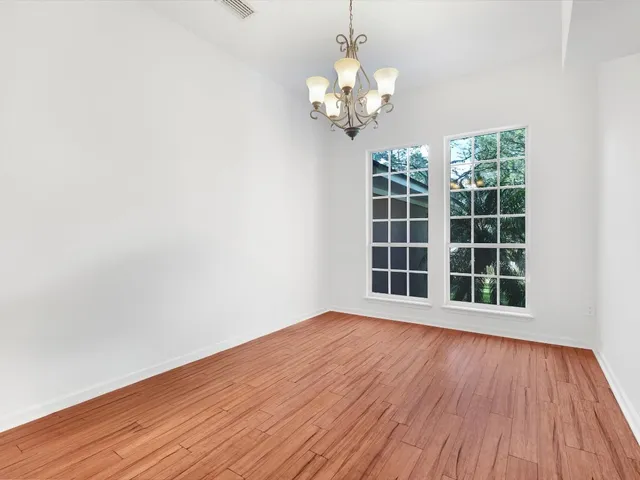 a kitchen with sink a microwave a stove and cabinets
