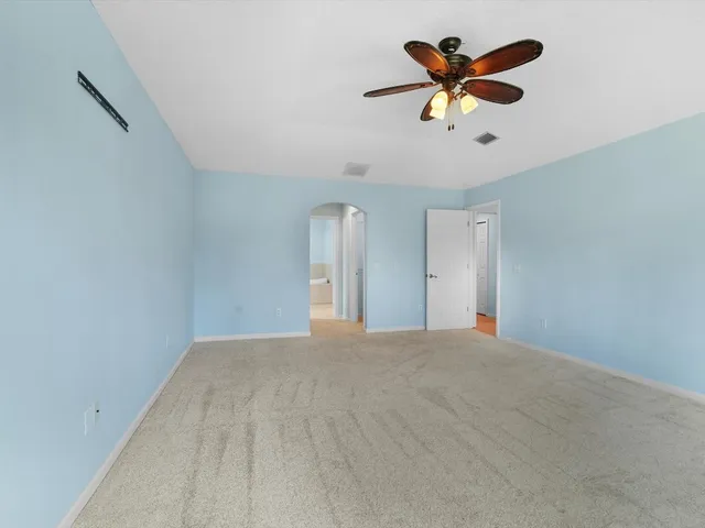 a view of room with a ceiling fan