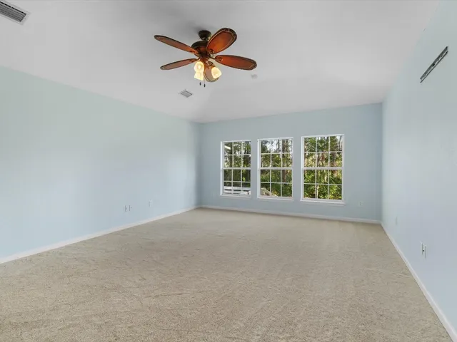 a spacious bathroom with a bathtub sink and mirror