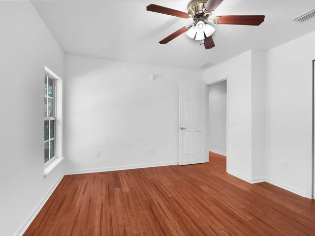 a spacious bathroom with a double vanity sink mirror and shower