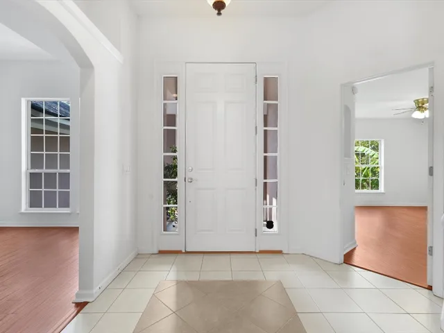 a view of livingroom with hardwood floor and fan