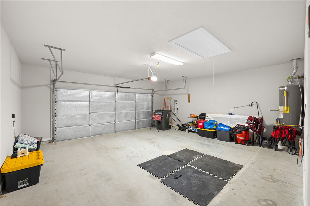 3088 Peterson Circle Bryan, TX 77802 - Photo 23 of 29 Garage featuring water heater