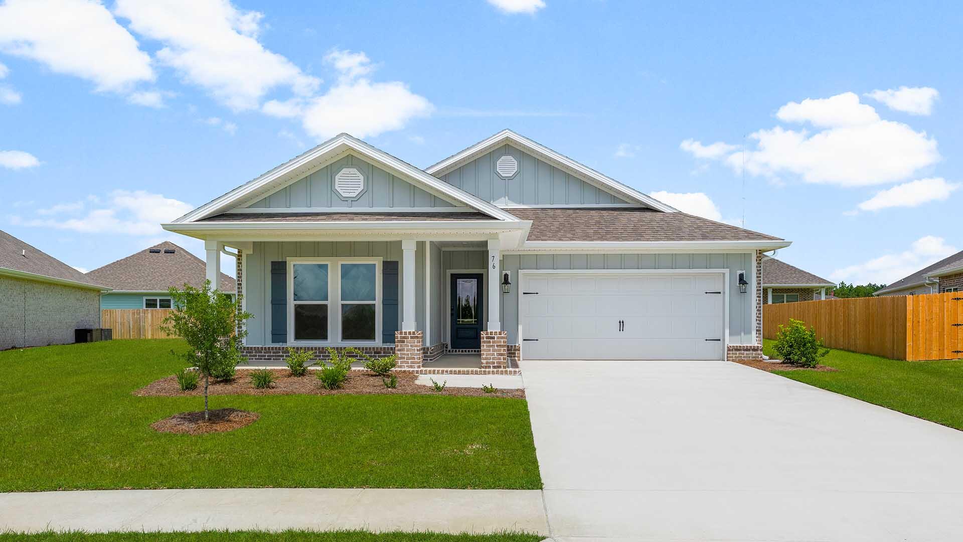 76 Grass Owl Loop Freeport, FL 32439 - Photo 1 of 39 a front view of a house with a yard