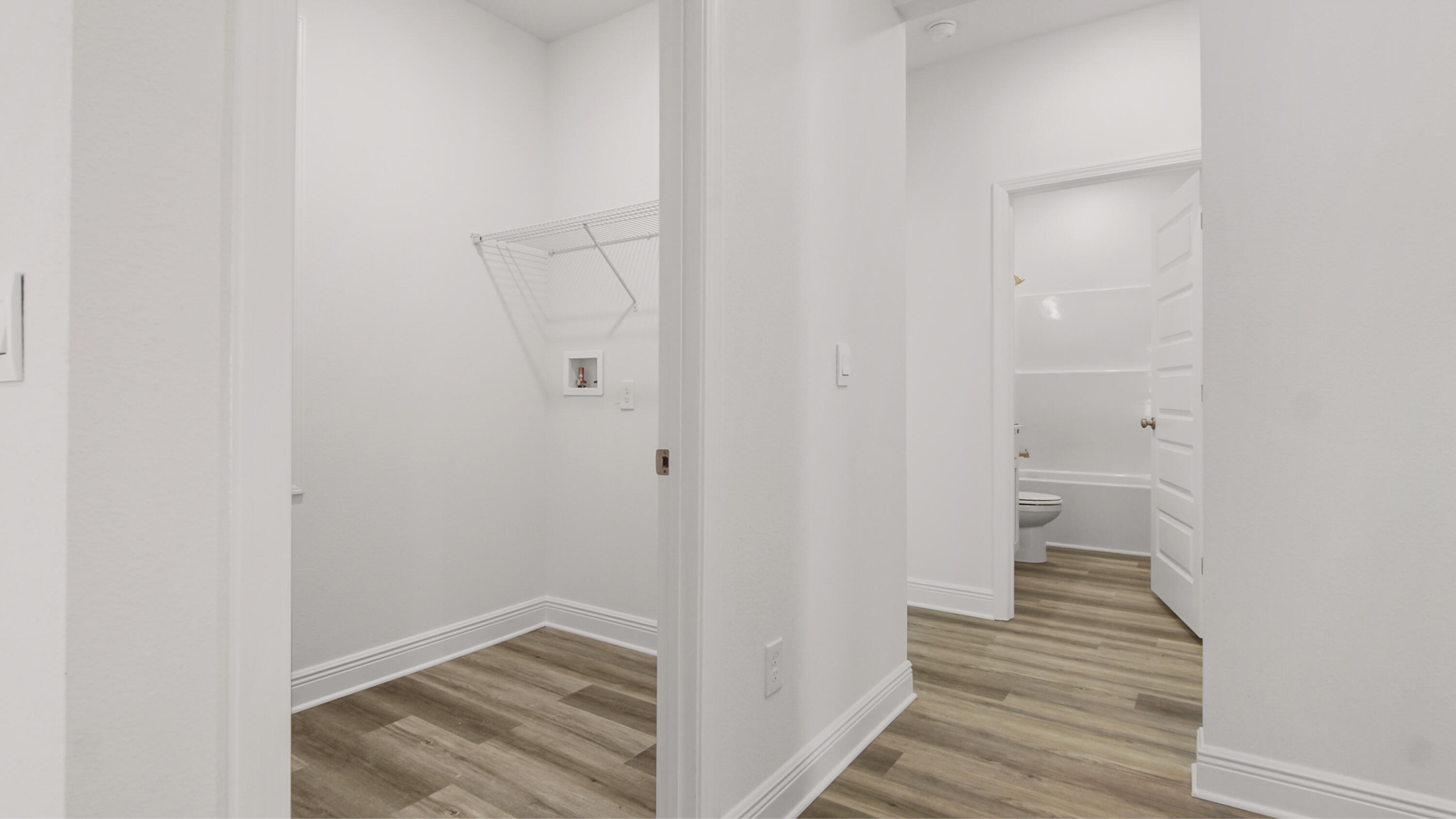 76 Grass Owl Loop Freeport, FL 32439 - Photo 17 of 39 a view of a hallway with wooden floor and closet