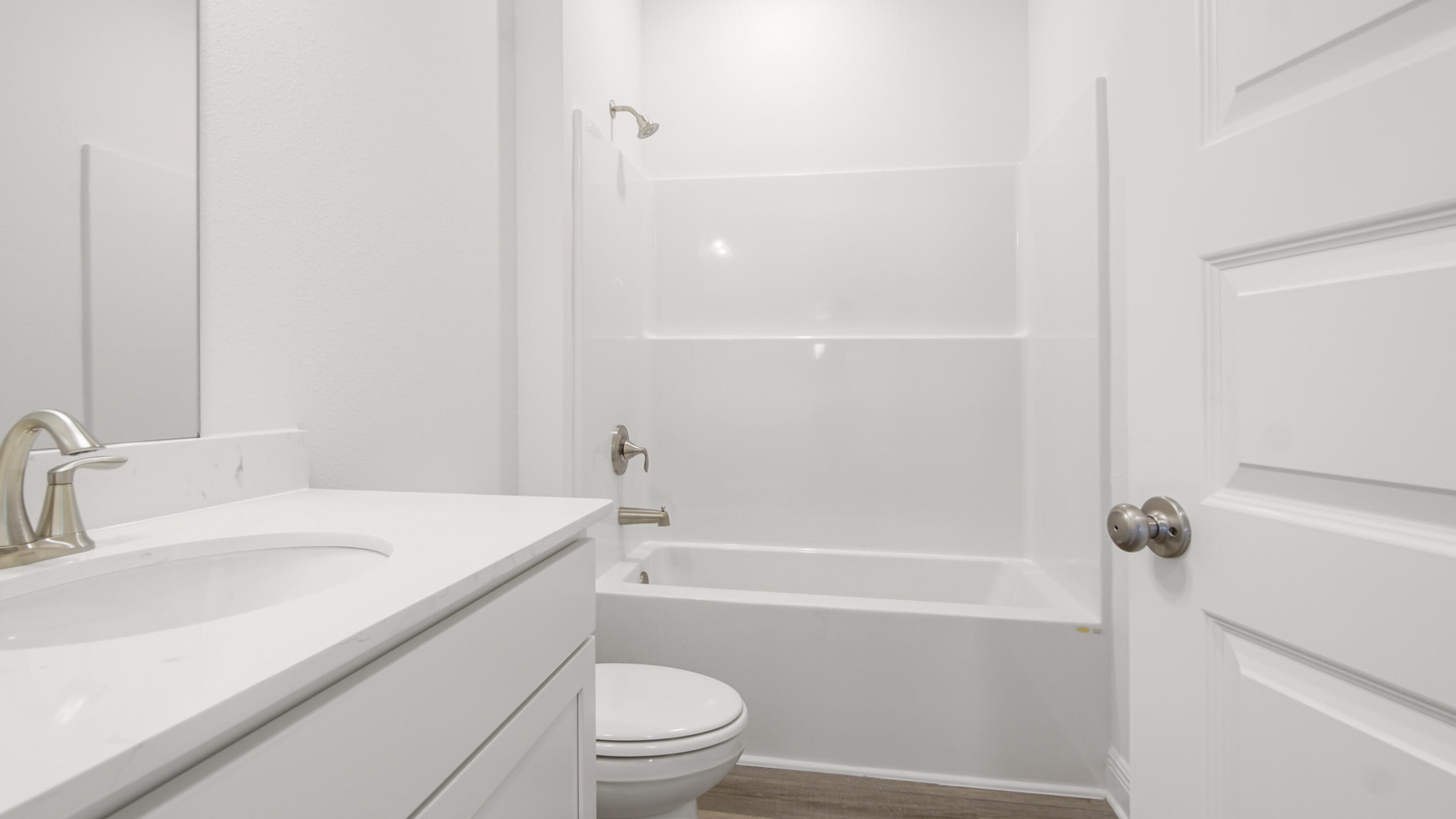 76 Grass Owl Loop Freeport, FL 32439 - Photo 19 of 39 a bathroom with a sink a toilet and shower