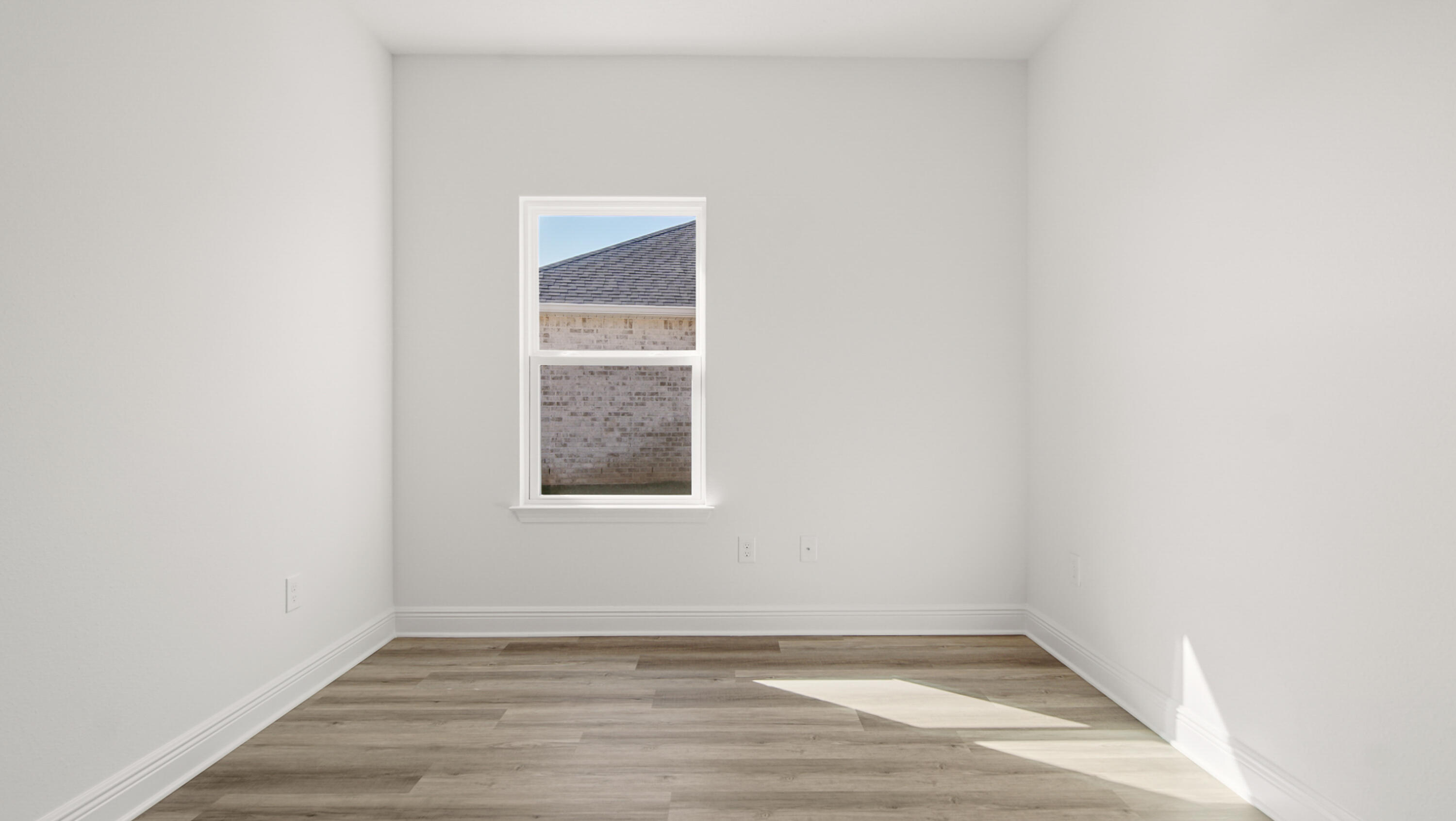 76 Grass Owl Loop Freeport, FL 32439 - Photo 22 of 39 a view of an empty room with wooden floor and a window