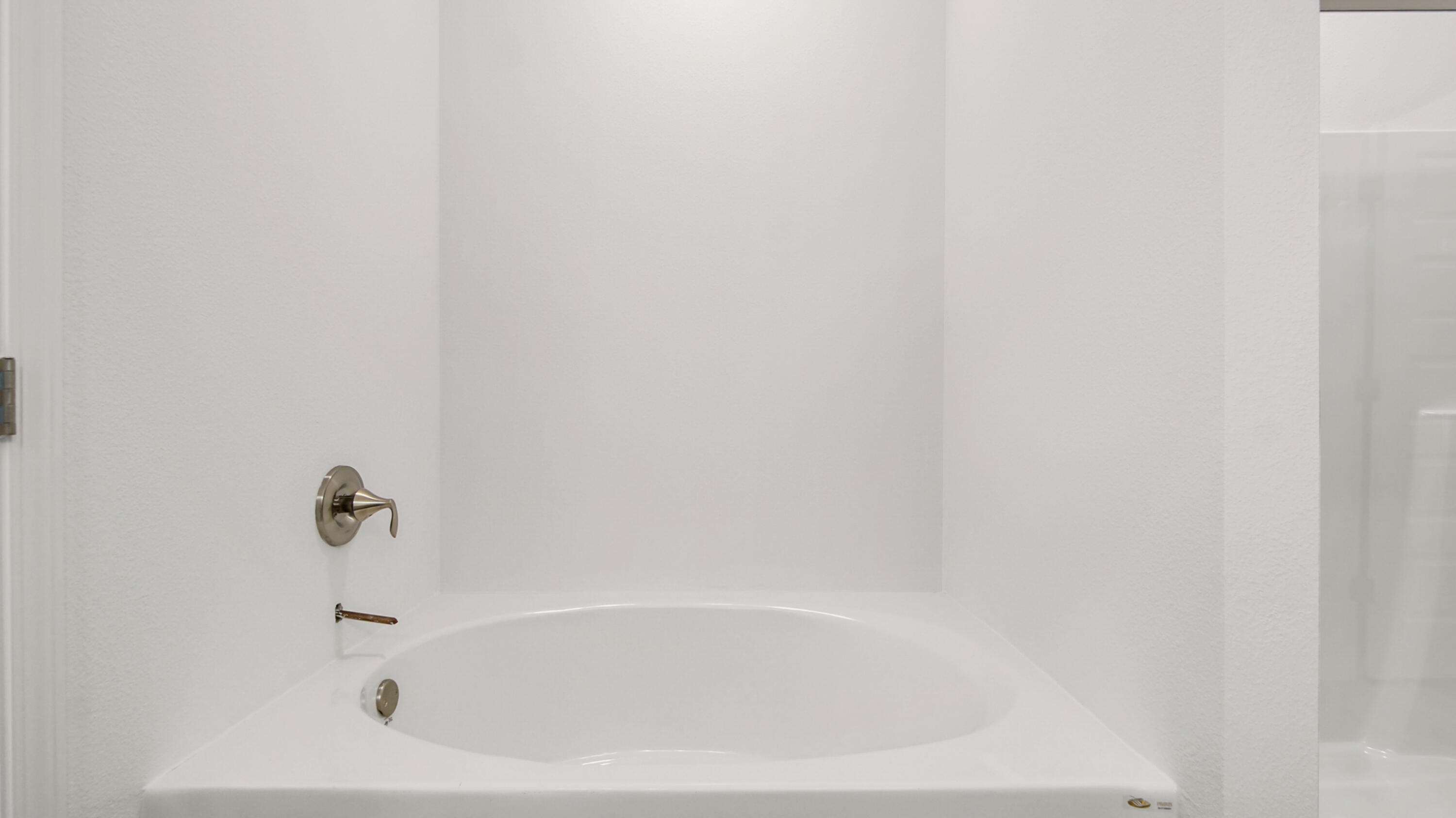 76 Grass Owl Loop Freeport, FL 32439 - Photo 28 of 39 a white bath tub sitting next to a white sink and vanity
