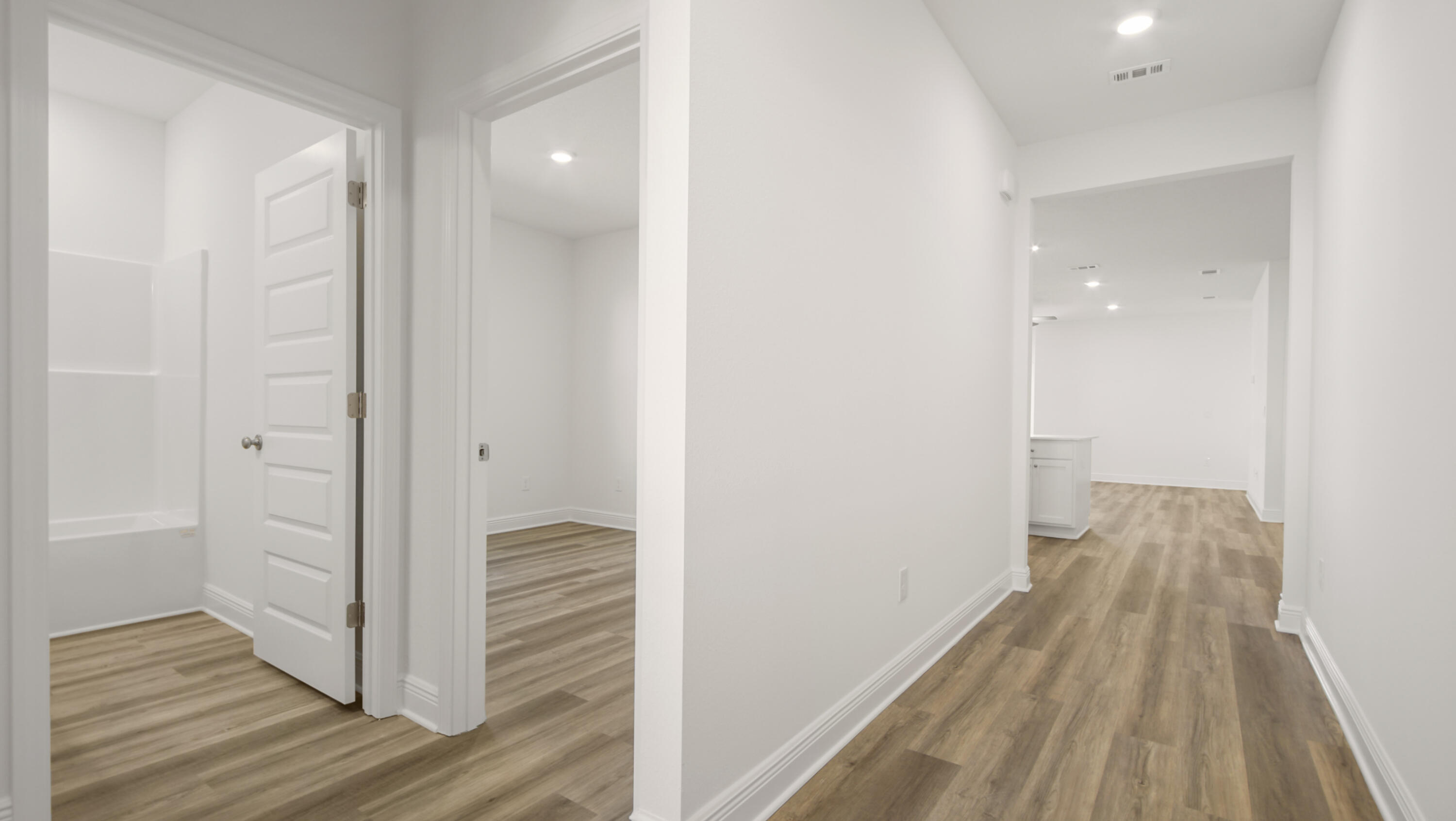 76 Grass Owl Loop Freeport, FL 32439 - Photo 3 of 39 a view of a hallway with wooden floor and staircase