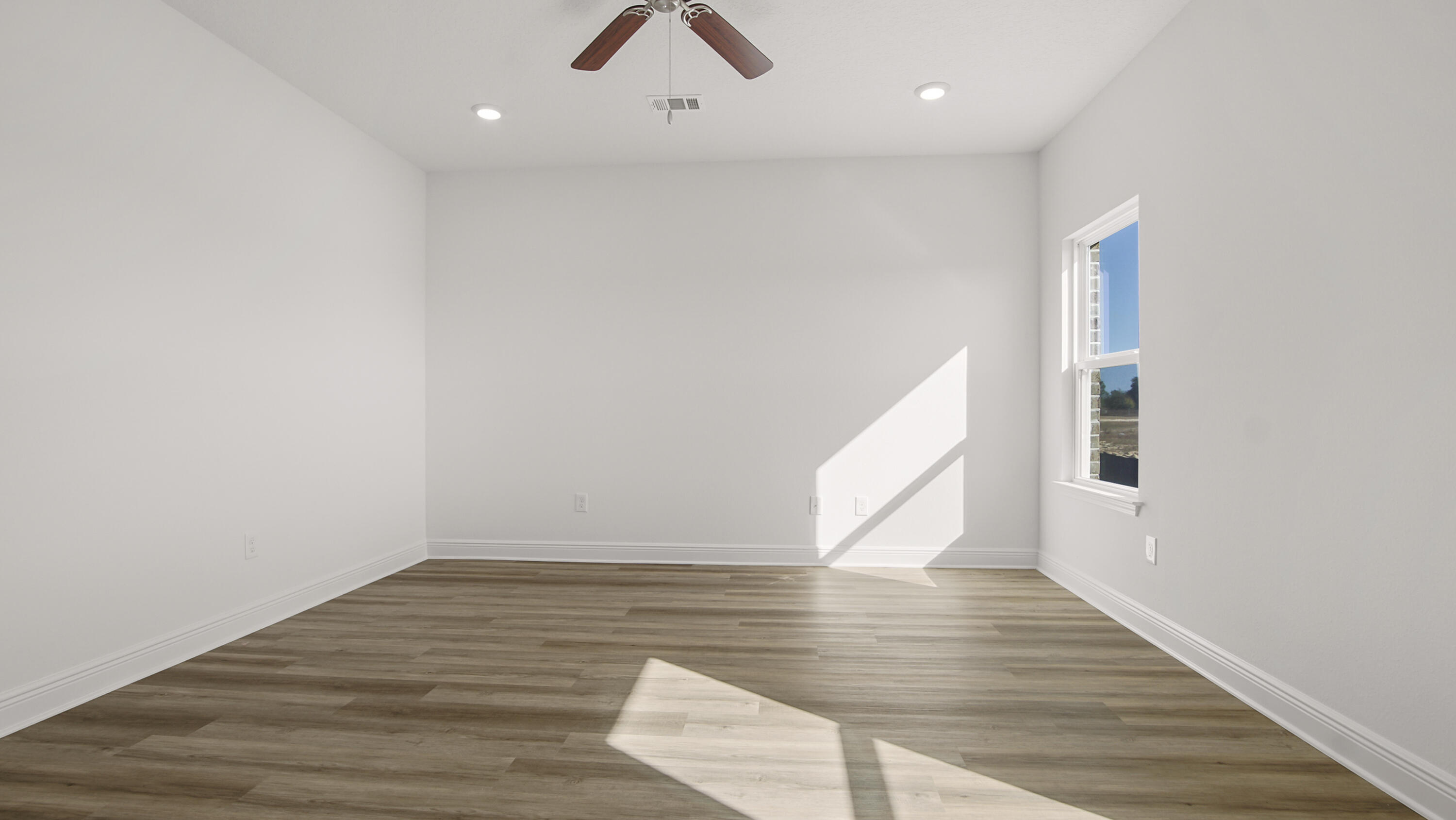 76 Grass Owl Loop Freeport, FL 32439 - Photo 32 of 39 a view of an empty room with wooden floor and stairs