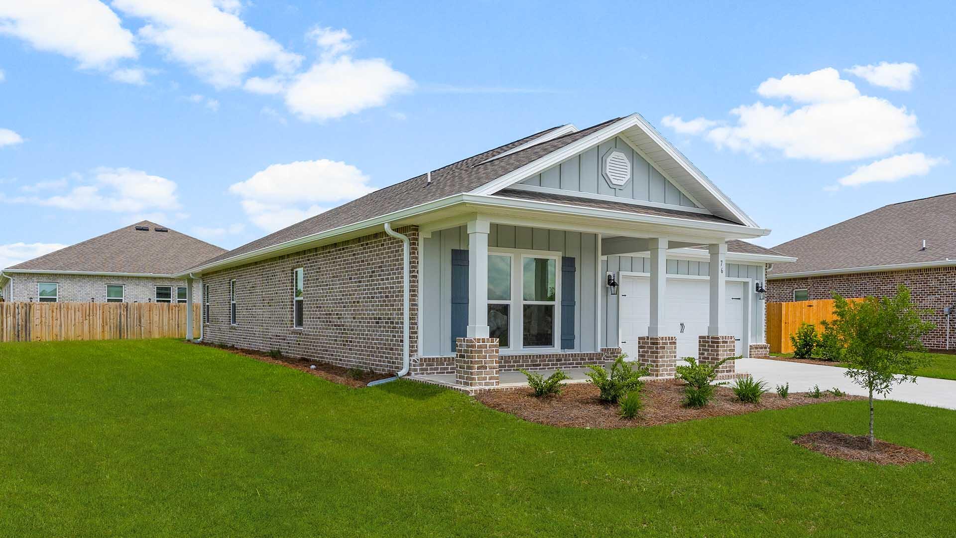 76 Grass Owl Loop Freeport, FL 32439 - Photo 37 of 39 a view of a house with a yard and porch