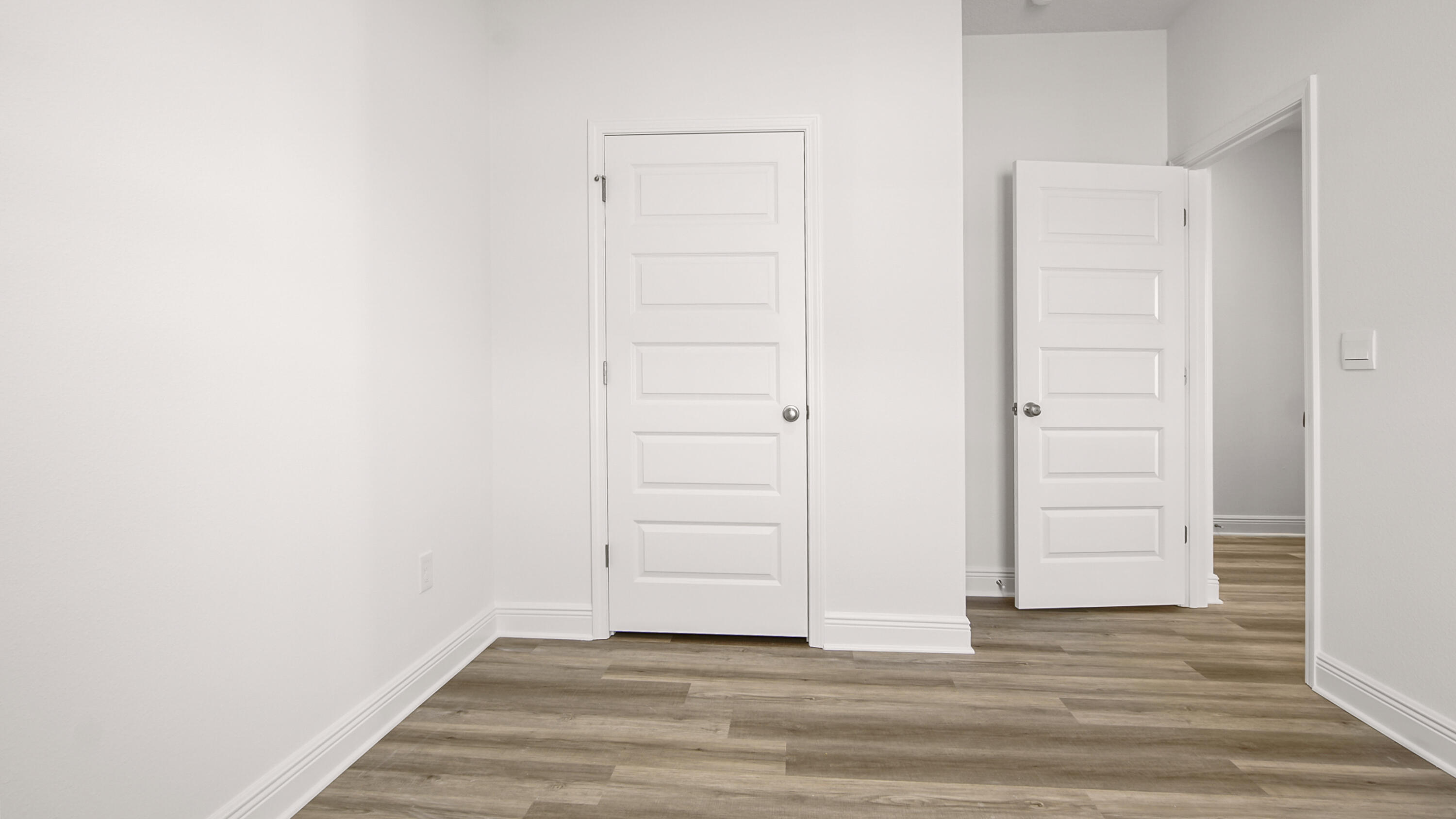 76 Grass Owl Loop Freeport, FL 32439 - Photo 8 of 39 an empty room with wooden floor