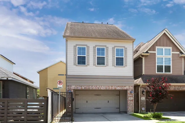 a front view of a house with garage