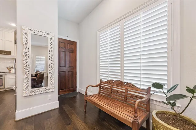 a bedroom with furniture and a window