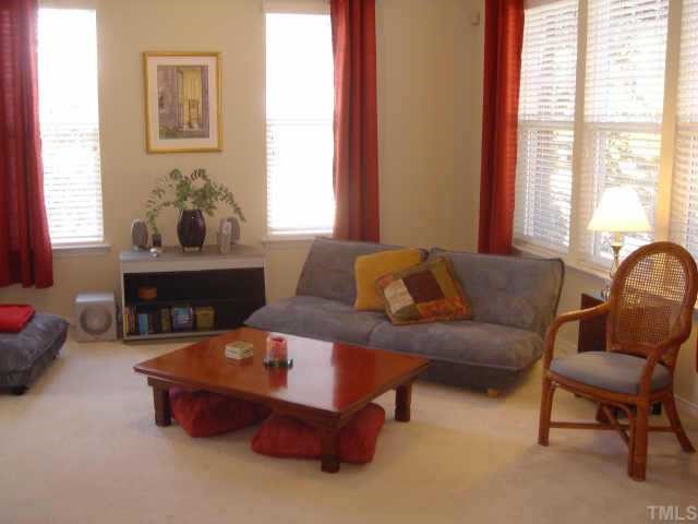 8508 Flying Buttress Drive Raleigh, NC 27613 - Photo 4 of 12 a living room with furniture and a potted plant