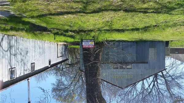 a backyard of a house with a lake view