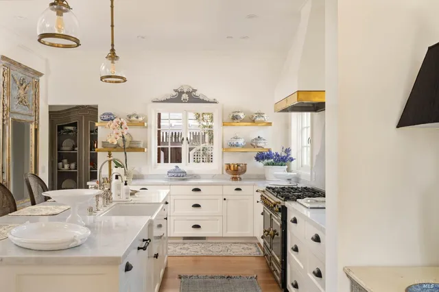 a bathroom with a sink vanity granite tub and a mirror