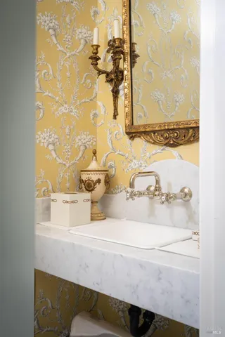 a bathroom with a sink and mirror