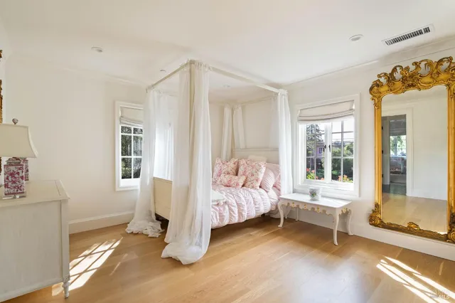 a bed room with a bed and a window