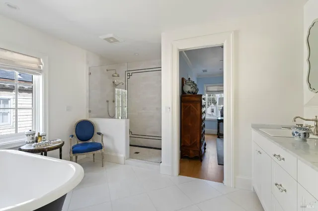 a room with a sink and a mirror