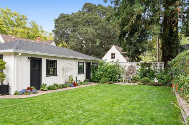 a front view of house with yard and green space