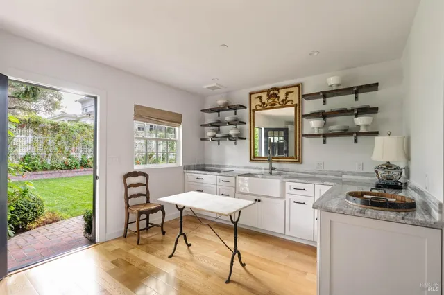 a kitchen with a sink cabinets and window