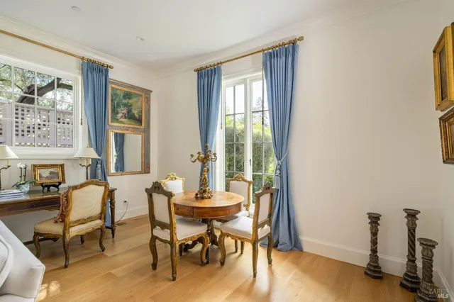 a view of a livingroom with furniture and a window
