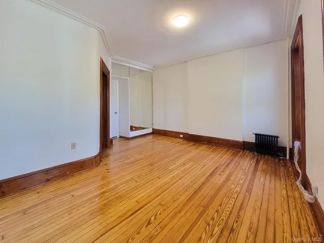a view of room with wooden floor