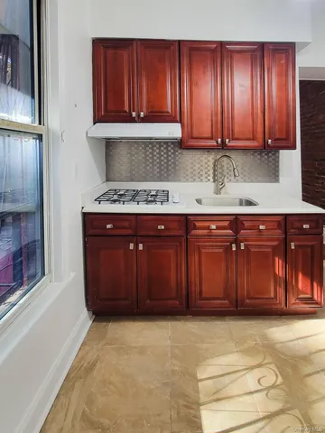 a kitchen with a sink and cabinets