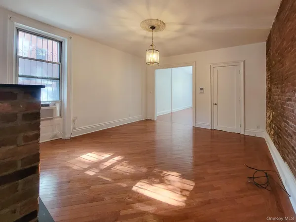 a view of livingroom with hardwood floor and window
