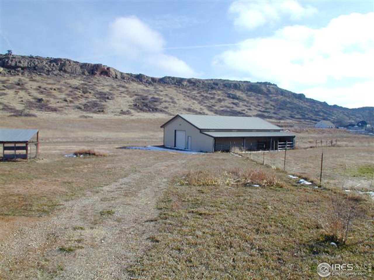 7090 Spring Glade Road Loveland, CO 80538 - Photo 18 of 18 a front view of a house with a yard