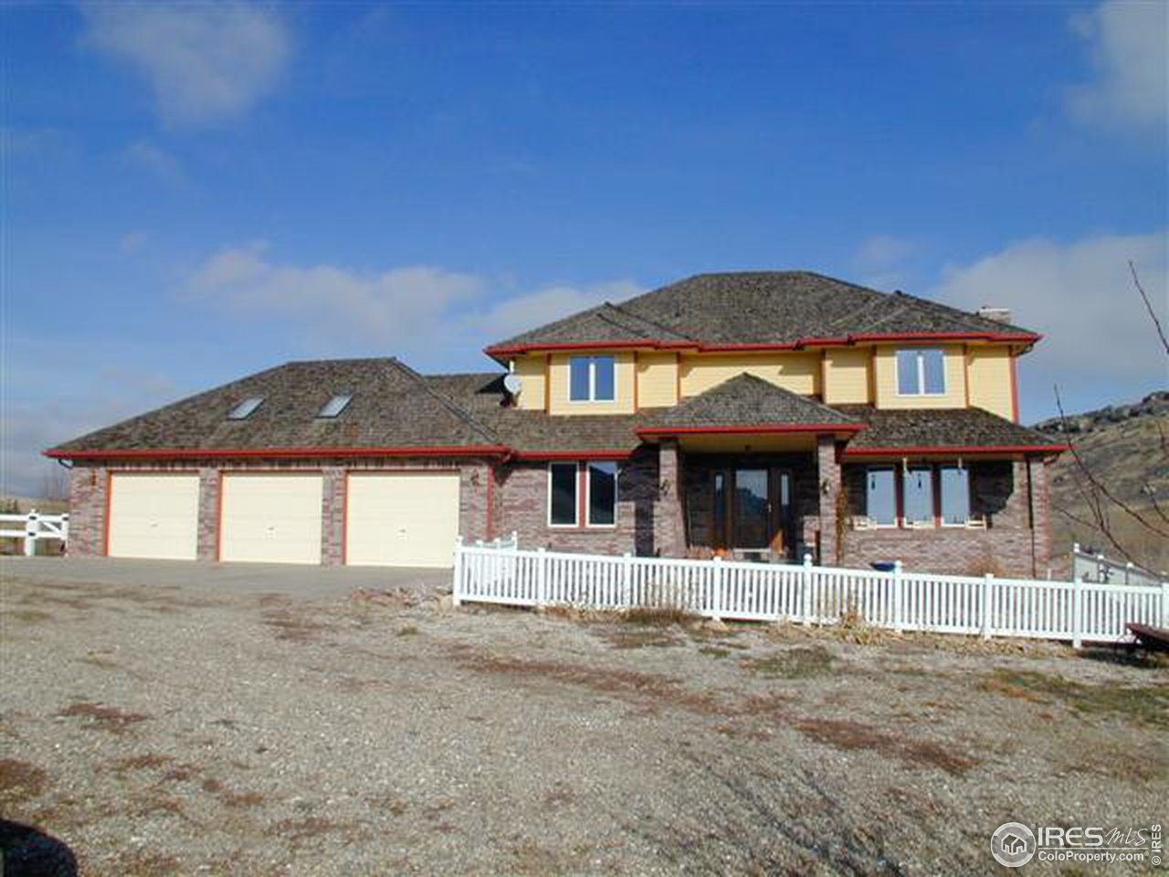 7090 Spring Glade Road Loveland, CO 80538 - Photo 2 of 18 front view of a house with a yard