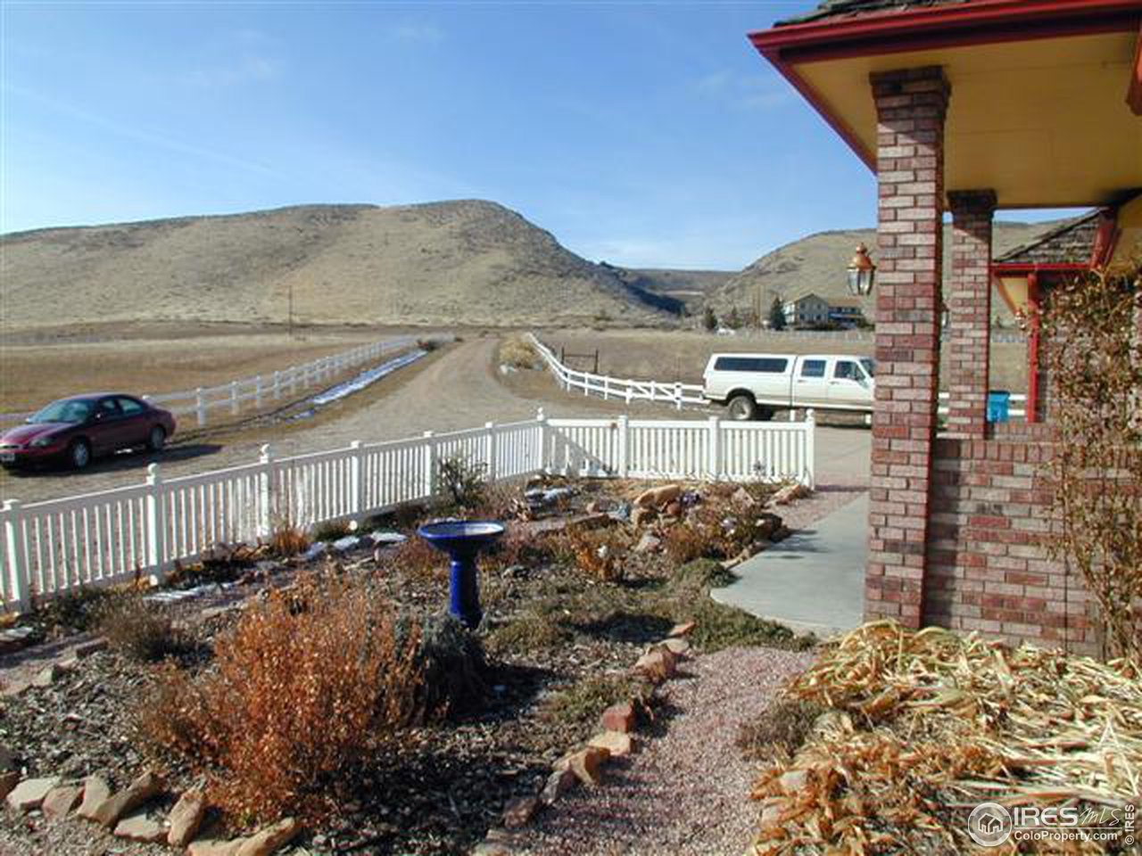 7090 Spring Glade Road Loveland, CO 80538 - Photo 4 of 18 a front view of a house with a yard