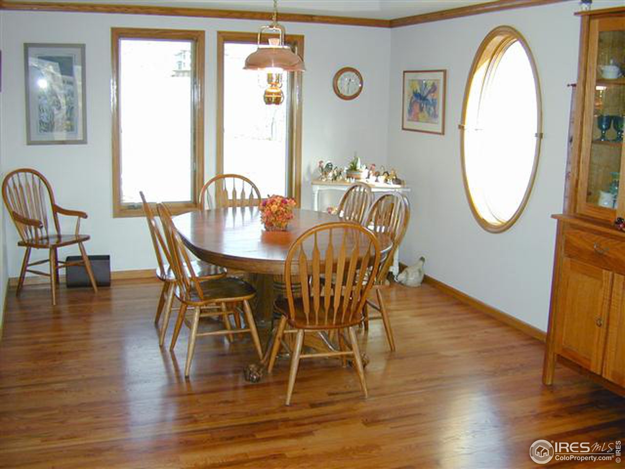 7090 Spring Glade Road Loveland, CO 80538 - Photo 9 of 18 a view of a dining room with furniture and wooden floor