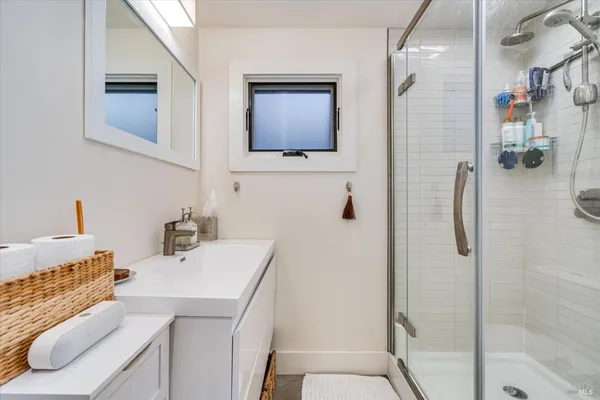 a bathroom with a sink and mirror