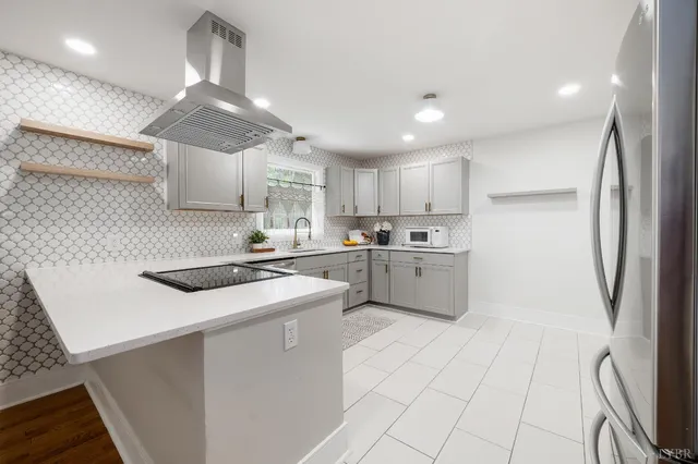 a kitchen with a stove and a sink