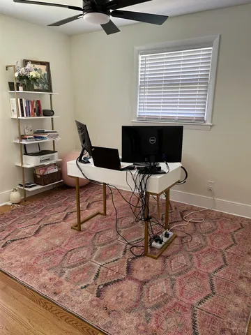a bathroom with a sink vanity mirror and toilet