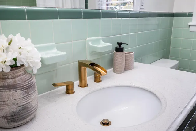 a view of a big room with wooden floor and windows