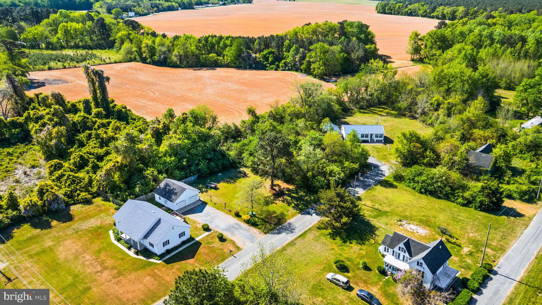 1548 Grant Road Stockton, MD 21864 - Photo 2 of 4 an aerial view of a house with yard swimming pool and outdoor seating
