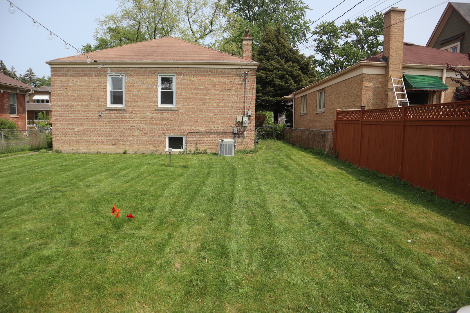 3218 Cuyler Avenue Berwyn, IL 60402 - Photo 15 of 17 a view of backyard with small cabin and wooden fence