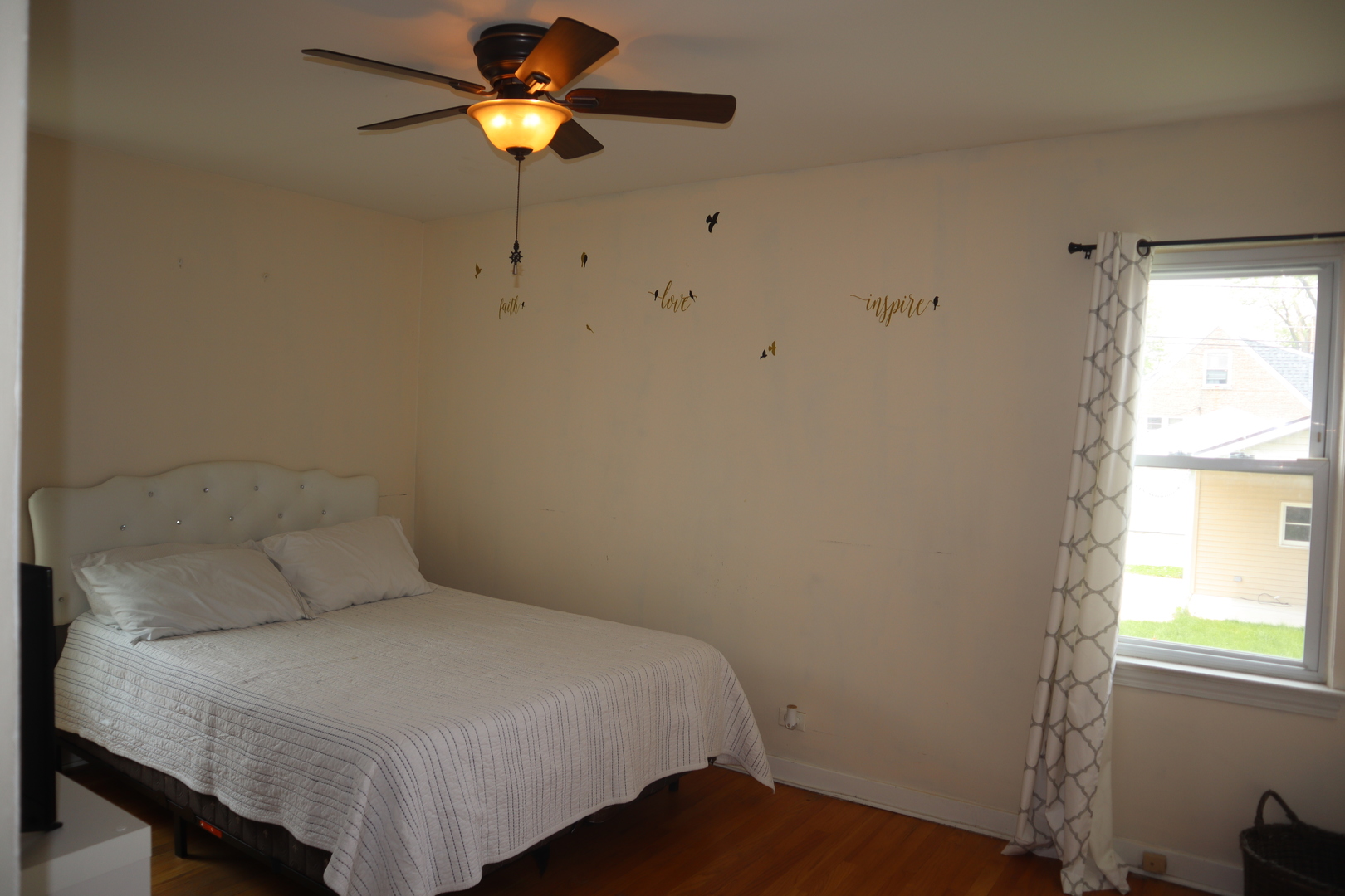 3218 Cuyler Avenue Berwyn, IL 60402 - Photo 6 of 17 a bedroom with a bed and a chandelier