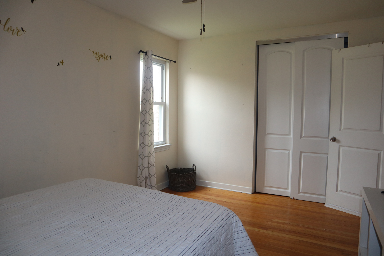 3218 Cuyler Avenue Berwyn, IL 60402 - Photo 7 of 17 a bedroom with a bed and a window