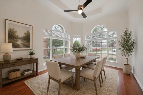 a view of a dining room with furniture window and wooden floor