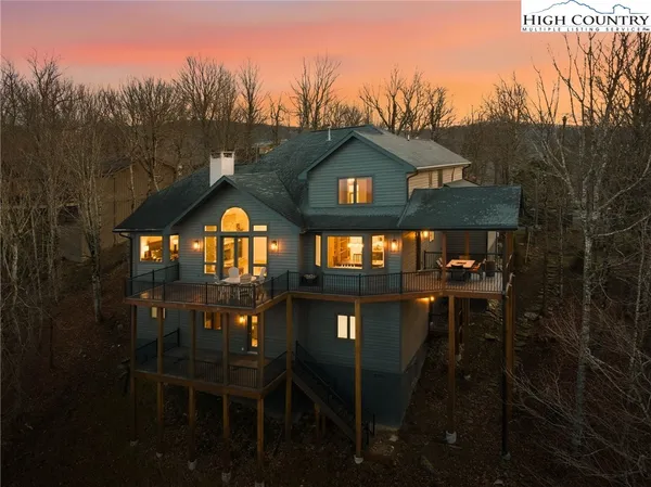 a view of balcony with outdoor seating and city view