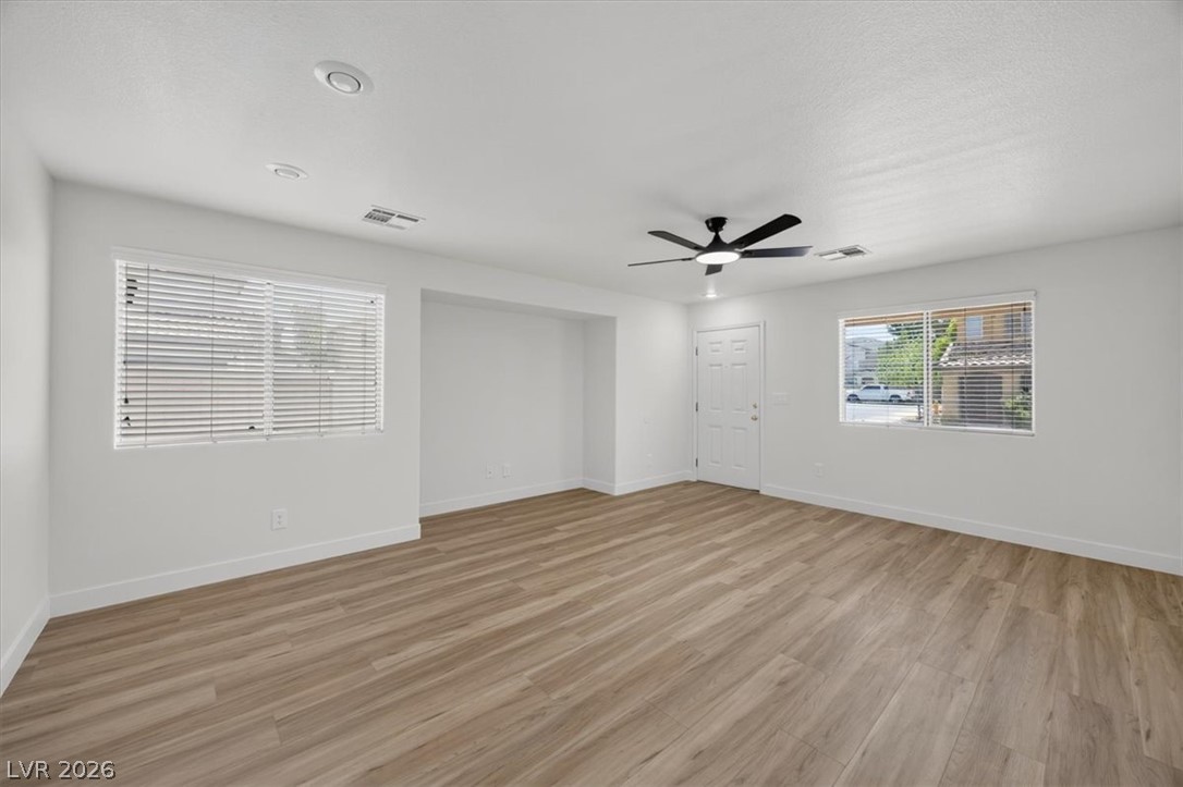 552 Albacate Street Henderson, NV 89015 - Photo 6 of 40 A versatile great room features abundant light, recessed lighting, and durable vinyl plank flooring throughout.