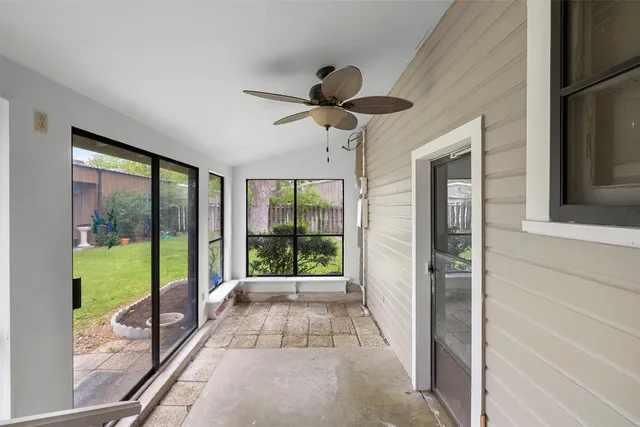 a view of a living room and floor to ceiling window