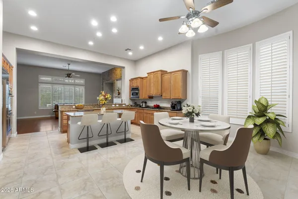 a kitchen with stainless steel appliances granite countertop a stove a sink dishwasher and a refrigerator