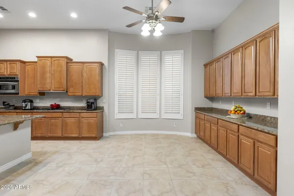 a view of a kitchen with a sink and cabinets