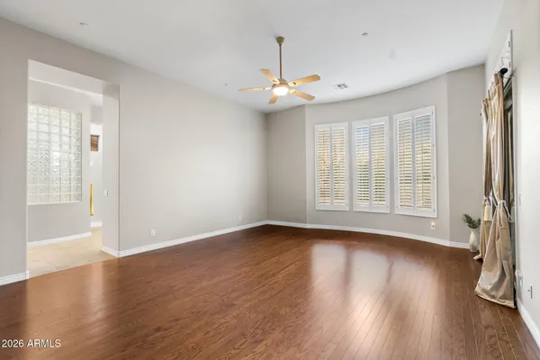 a bathroom with a granite countertop double vanity sink and a mirror