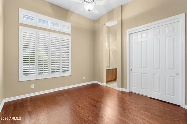 a view of a white house with a yard and sitting area