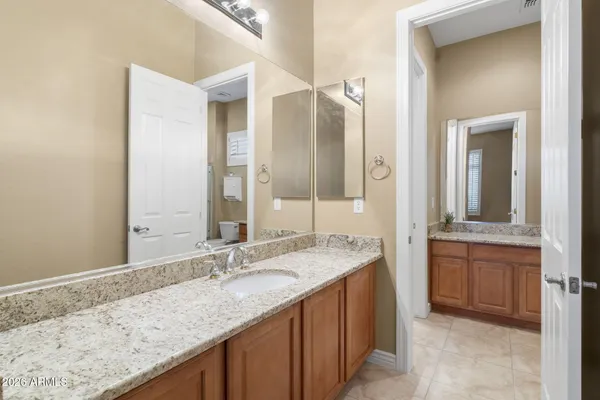 a view of a patio with couches table and chairs and potted plants